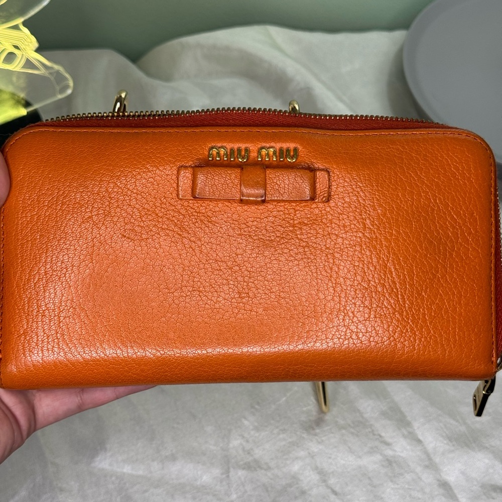 EUC BURNT ORANGE BOW MIU MIU LONG ZIPPY WALLET WITH ✨SHINY✨GOLD HARDWARE
